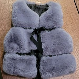 Little girl stylish fur-like vest